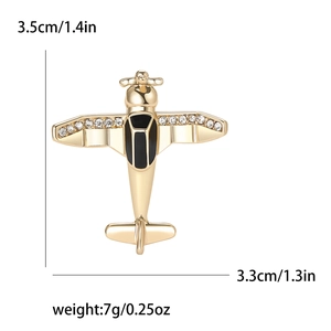 Golden airplane brooch with white rhinestones and black enamel finish for men and women