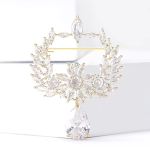 Elegant gold olive branch brooch with marquise zircon stones and pear-shaped drop crystal