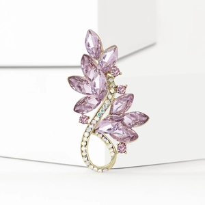 Detailed macro view of vintage crystal bouquet brooch with lavender marquise stones