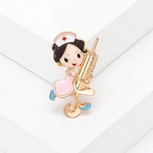 Cute cartoon nurse enamel brooch pin with pink uniform and golden syringe design
