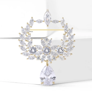 Elegant olive branch laurel brooch in gold plating with teardrop zircon pendant