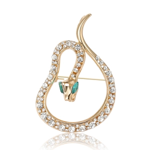 Luxury gold snake brooch featuring sparkling white rhinestones and green emerald eyes