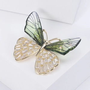 Exquisite crystal butterfly brooch with green wings and gold-plated frame for women