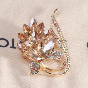 Detailed macro shot of vintage floral brooch with amber marquise rhinestones and gold plating