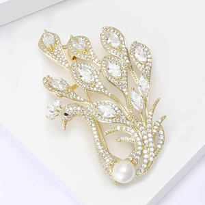Exquisite gold peacock brooch with sparkling zircon feathers and a white round pearl accent
