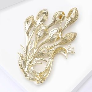 Exquisite golden peacock brooch with pavé zircon detail shown from the back view