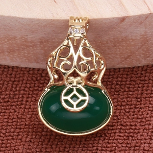 Detail view of S925 silver gourd earring with green Hetian jade and hollow metal pattern