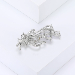 Detailed view of bouquet brooch back with secure silver safety pin and crystal setting
