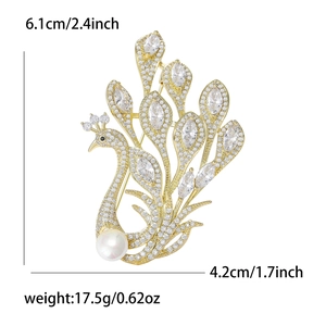 Elegant peacock brooch with white cubic zirconia and large pearl on gold base