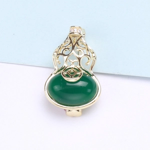 Macro shot of s925 silver hollow gourd earrings with green jasper and gold finish