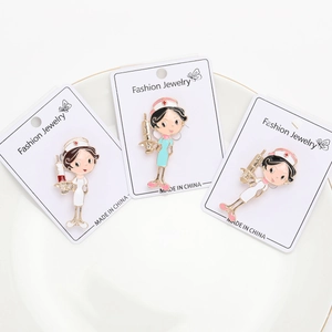 Detail view of cartoon nurse alloy enamel brooches with giant syringe designs