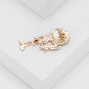 Detailed back view of a gold alloy nurse brooch showing secure pin clasp and matte texture