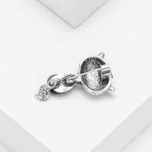 Vintage silver animal brooch with shell fox design and secure pin clasp on white base