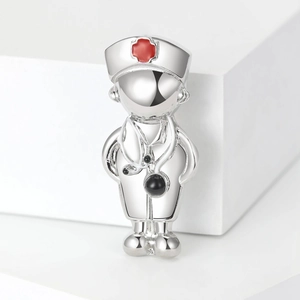 Silver creative doctor brooch with nurse hat and stethoscope detail on white blocks
