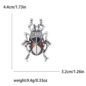 Luxury insect beetle brooch with rhinestones and enamel, measures 4.4cm by 3.2cm