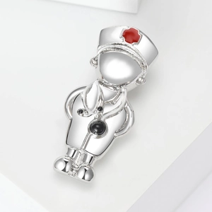 Nurse themed alloy brooch with red cross hat and stethoscope on minimalist white blocks