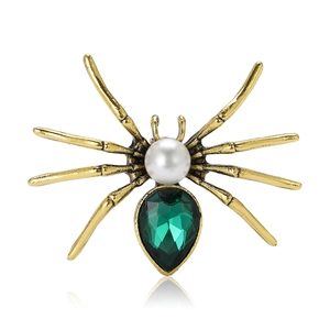 Vintage gold spider brooch with green gemstone and white pearl for suits and cardigans