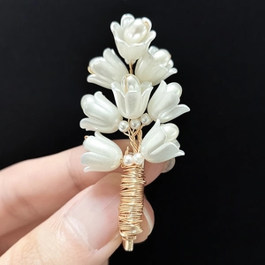 Exquisite handmade lily of the valley brooch with white bells and gold wire details