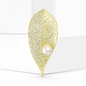Elegant gold leaf brooch with cubic zirconia crystals and a round white freshwater pearl