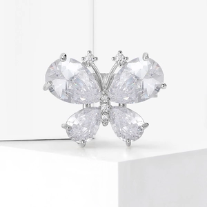 Elegant silver butterfly brooch featuring sparkling pear-shaped cubic zirconia on wings