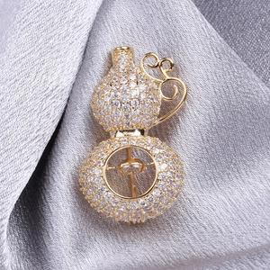 Luxurious brass gourd brooch with zircon pavé and dangling centerpiece on silver silk