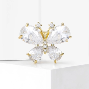 Elegant gold butterfly brooch with pear-shaped crystals and shimmering zirconia details