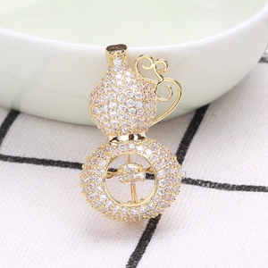 Luxury gold gourd brooch with sparkling micro-paved zircons and a dancing stone center