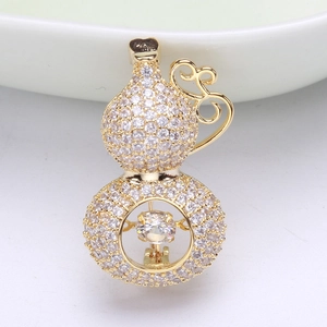 Macro shot of luxury gold gourd brooch with shimmering micro-pave cubic zirconia crystals