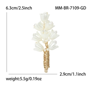 Handmade lily of the valley brooch with white petals, pearls, and gold wire stem details