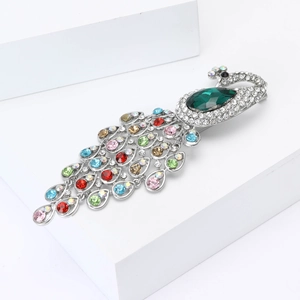 Elegant silver peacock brooch with sparkling colorful rhinestones and green gemstone