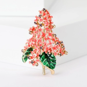 Detail of pink hydrangea brooch with green enamel leaves and gold-plated finish