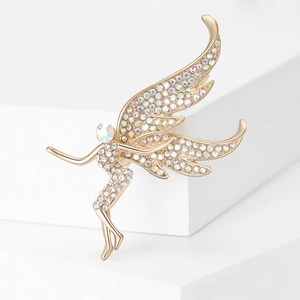 Detailed macro view of fairy brooch with golden plating and sparkling cubic zirconia crystals