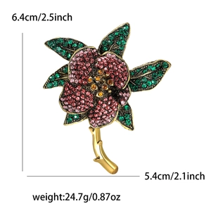 Vintage floral rhinestone brooch in pink and green with 6.4cm height and 5.4cm width
