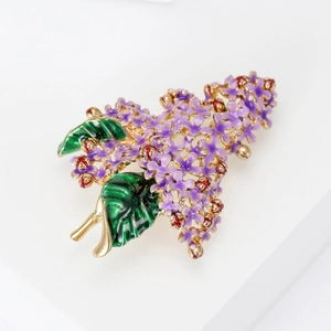 Macro detail of enamel lilac hydrangea brooch with purple petals and golden stems