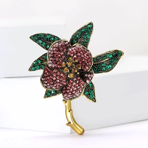 Vintage floral rhinestone brooch with purple crystals and gold alloy finish for women