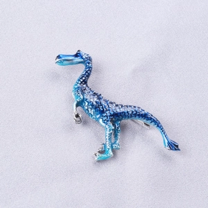 Cute cartoon dinosaur brooch with blue enamel gradient finish and detailed scale texture
