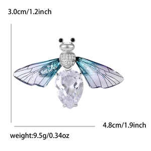 Detailed view of silver bee brooch with blue gradient wings and crystal body and measurements