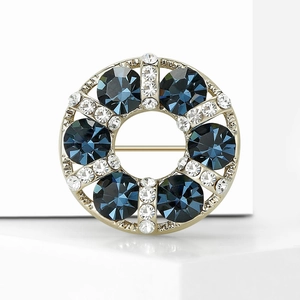 Elegant gold-plated wreath brooch with deep blue sapphires and sparkling rhinestones