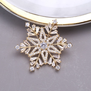 Elegant gold snowflake brooch with sparkling cubic zirconia crystals for women suits