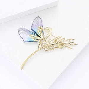 Elegant gold butterfly brooch with purple gradient wings and cubic zirconia accents