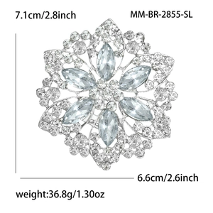 Elegant rhinestone flower brooch with silver metal base and crystal stones measuring 7.1cm