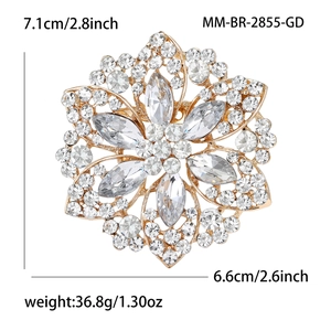 Detailed view of luxury gold alloy flower brooch with rhinestone and crystal clusters