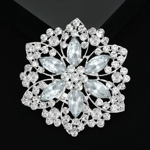Exquisite silver alloy flower brooch with sparkling crystal rhinestones on black background