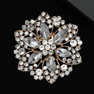 Macro shot of luxury flower brooch with crystals and gold-plated alloy details