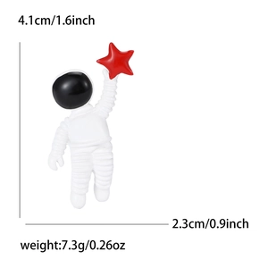 Creative astronaut enamel brooch pin with red star and sizing dimensions 4.1cm by 2.3cm