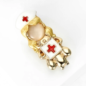 Nurse brooch with cat eye stone and red cross detail on golden metal finish