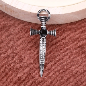 Detailed view of punk sword brooch featuring vintage silver finish and black gemstone