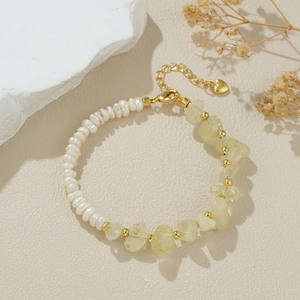 Baroque pearl and yellow gemstone asymmetric bracelet with adjustable gold heart charm