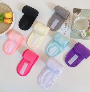 Flat lay of colorful microfiber headbands with adjustable velcro for spa and makeup