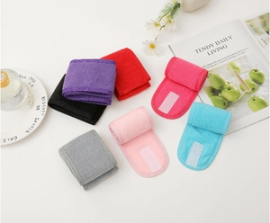 Close-up of colorful SPA headbands with adjustable velcro closures and soft fabric